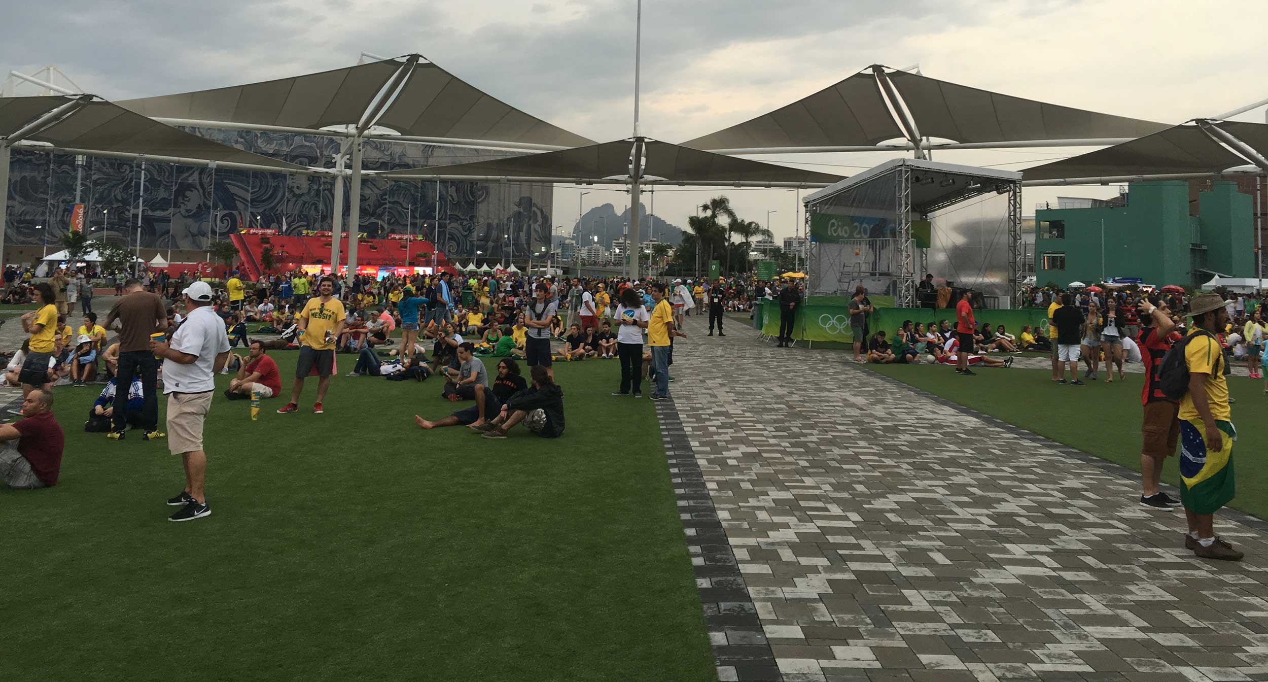 Brazilian fans mill about in the Olympic Park in Rio de Janeiro, Brazil before the men's soccer final