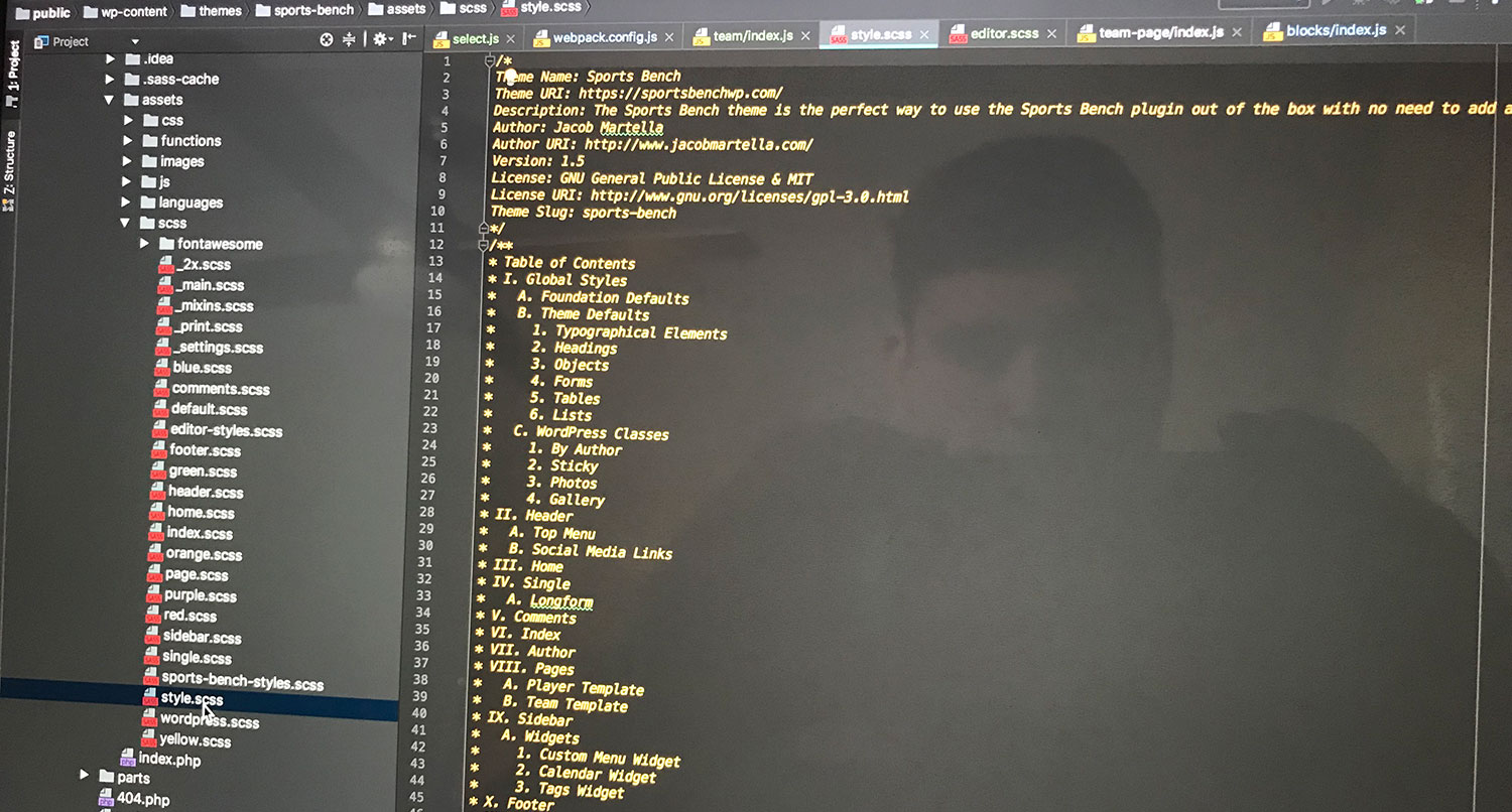 Screenshot of laptop with SCSS code