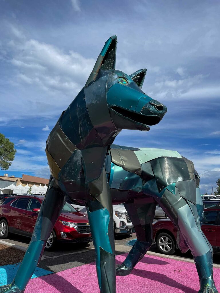 A blue sculpture of a wolf