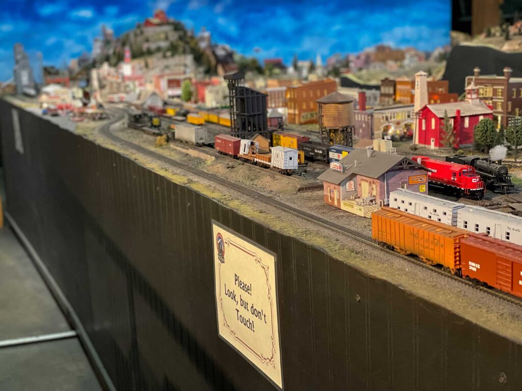 A town and train yard scene on a model railroad