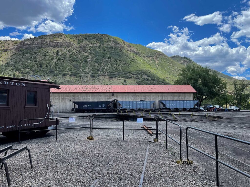 A train turntable with mountains in the background