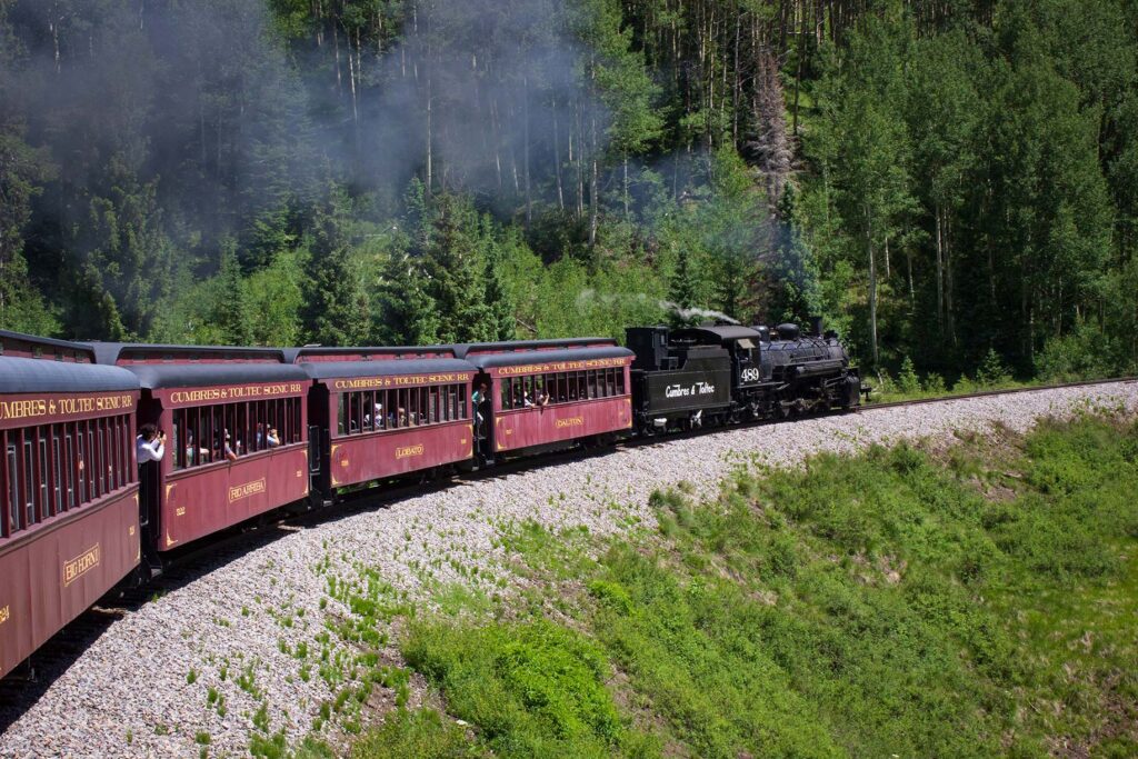 A train travels in the mountains