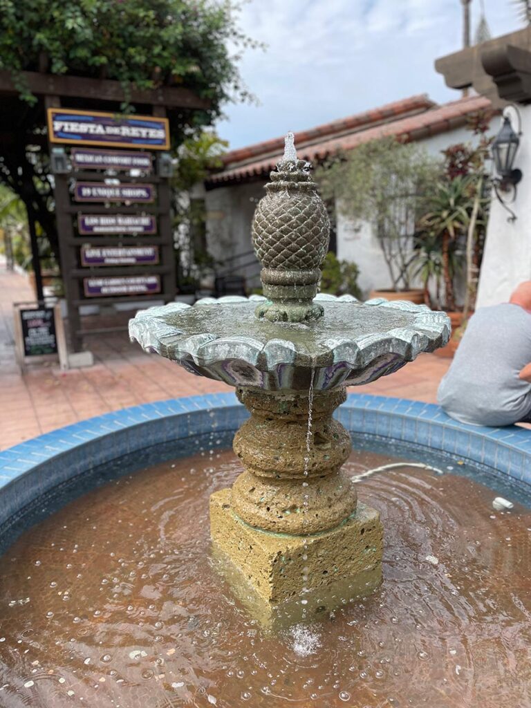 A small fountain in a plaza