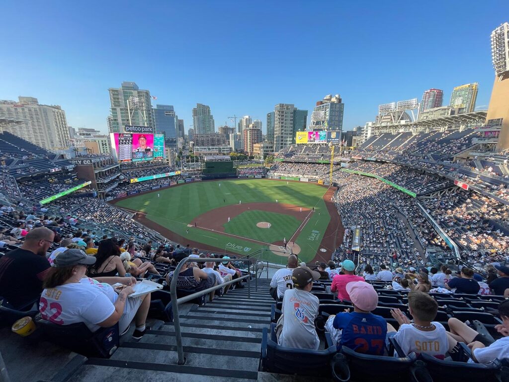 A view of the Petco Park baseball stadium looking out at downtown San Diego in early evening