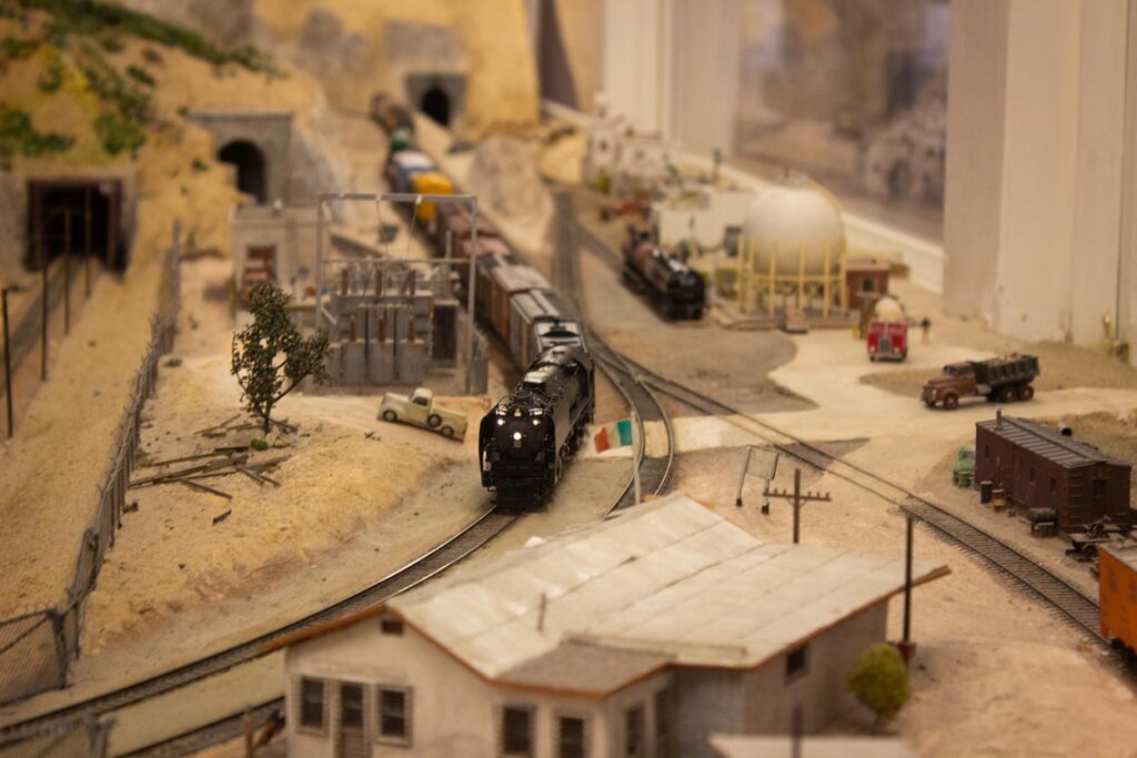 A steam train running on a model train layout