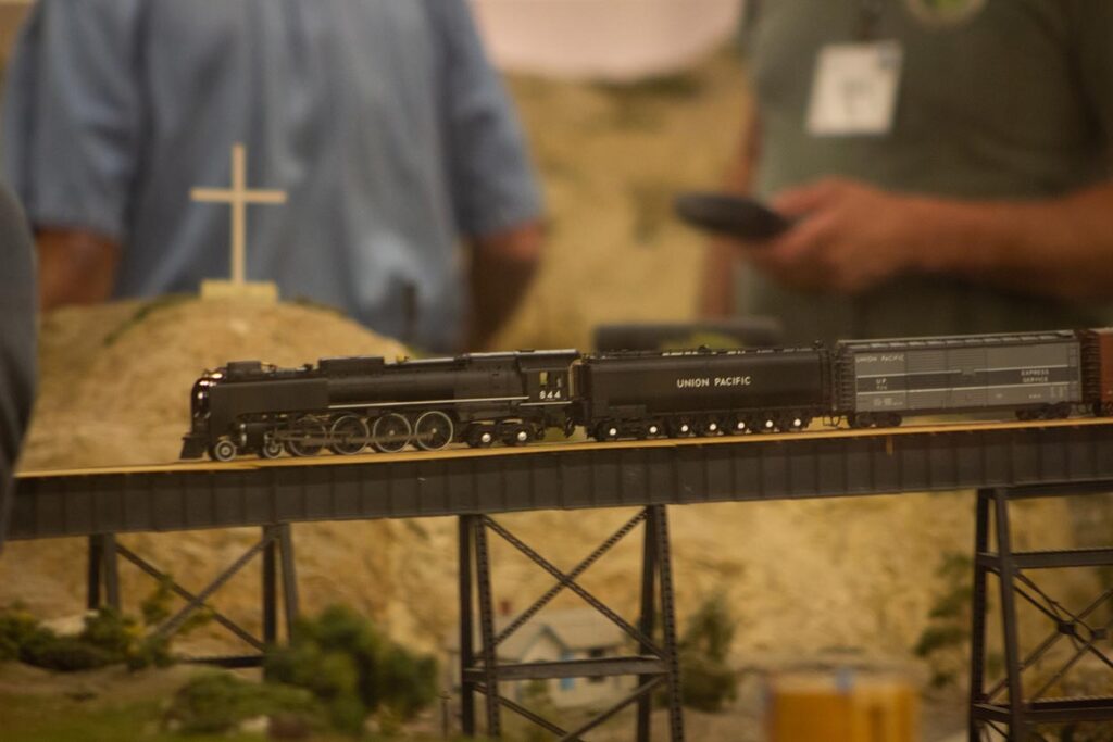 A Union Pacific steam train running on a model train layout