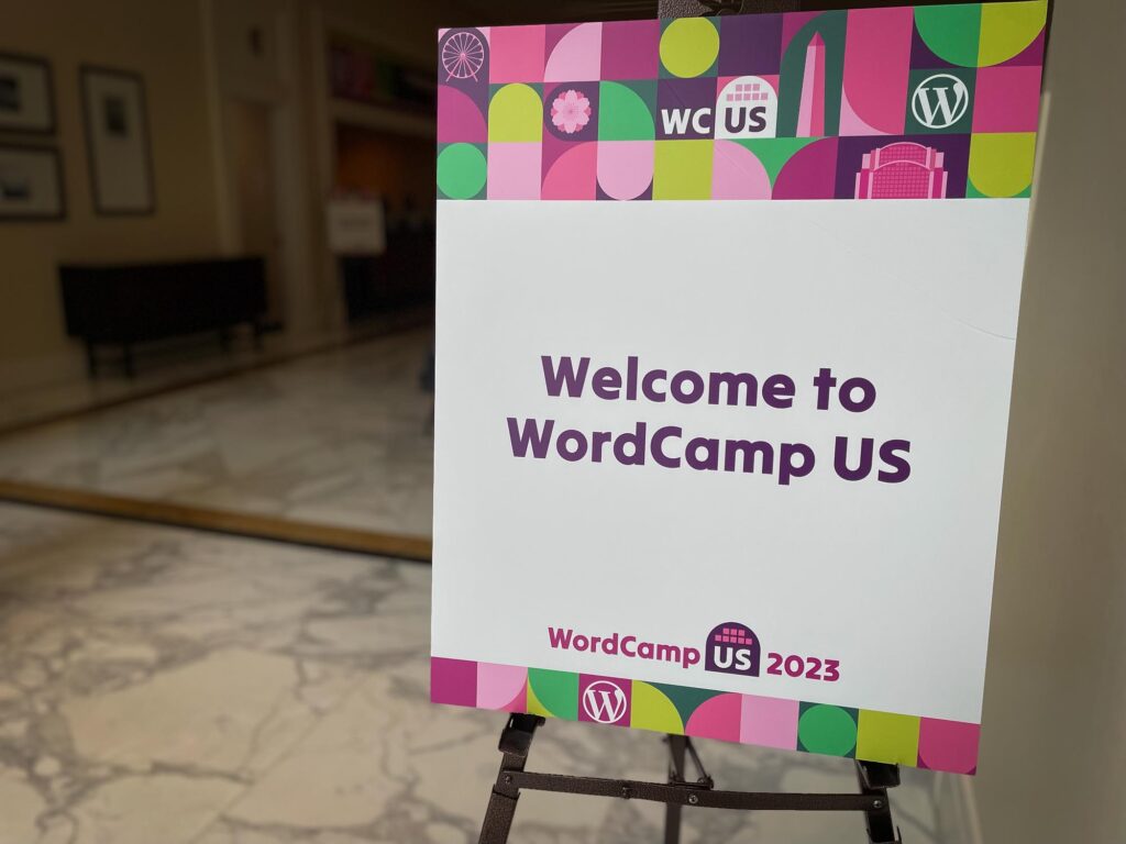 A sign saying "Welcome to WordCamp US"
