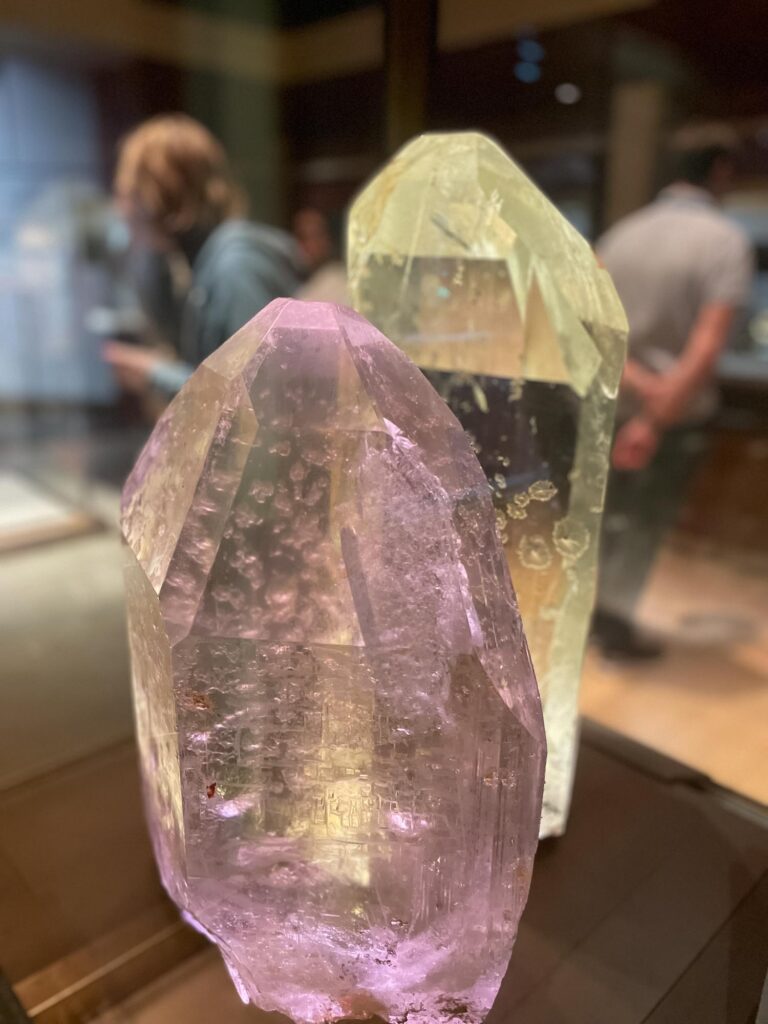 Large gemstones in a glass case in a museum exhibit