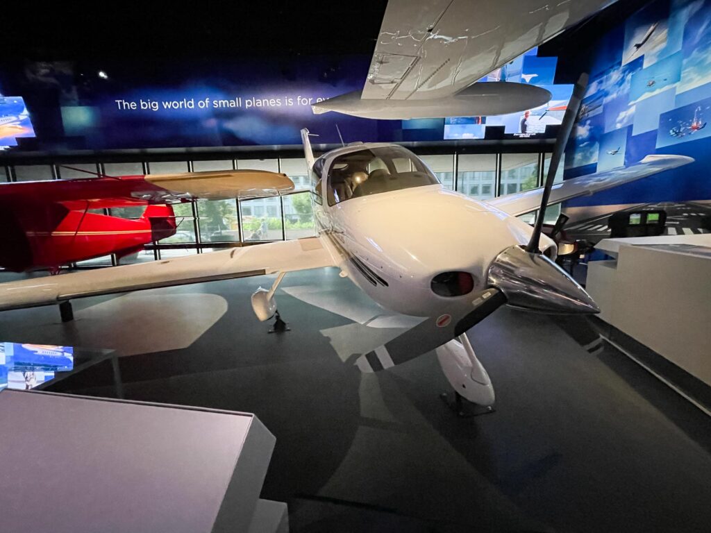 A white airplane sitting in a museum
