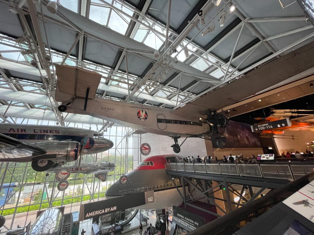An American Airlines mail propeller plane hanging in a museum