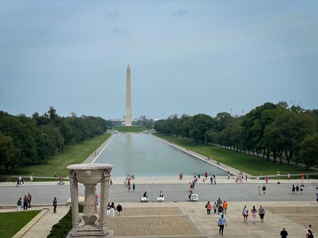 The Washington Monument in the distance with the reflecting pool in the foreground