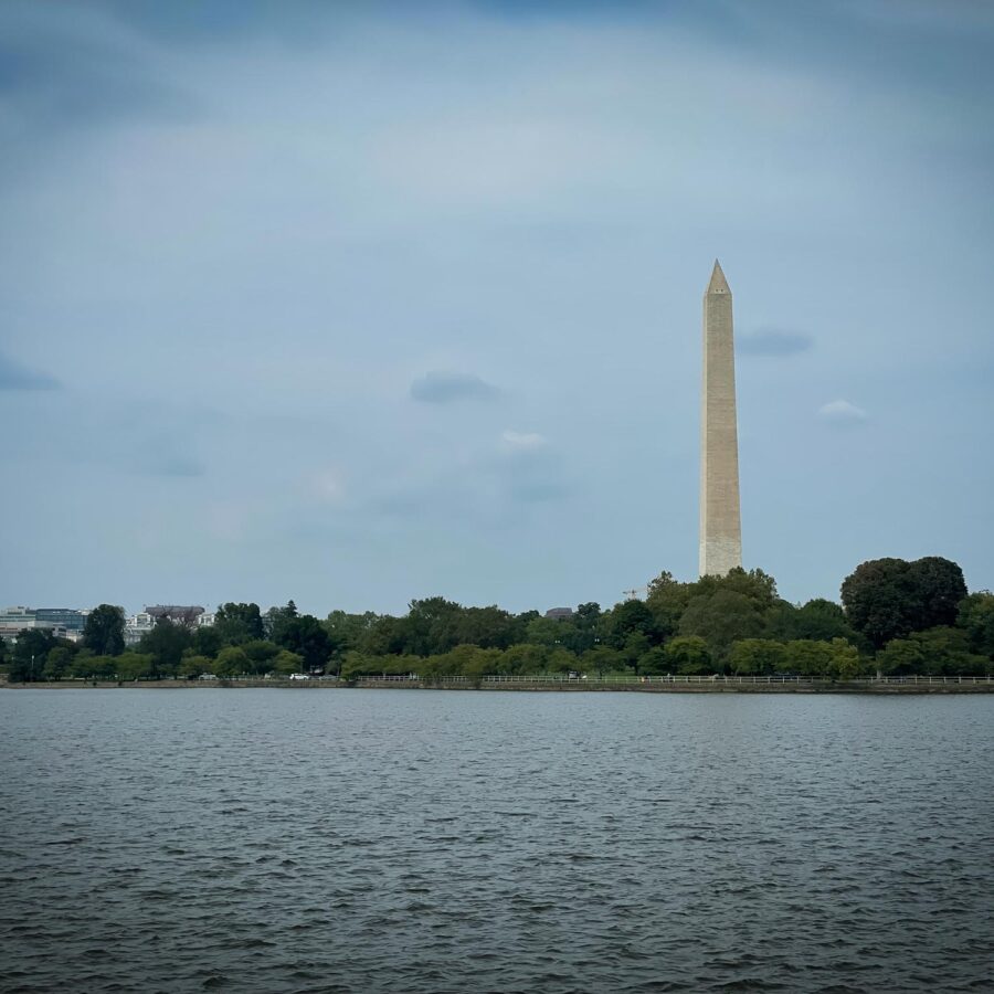 The Washington Memorial in the background with a body of water in the foreground