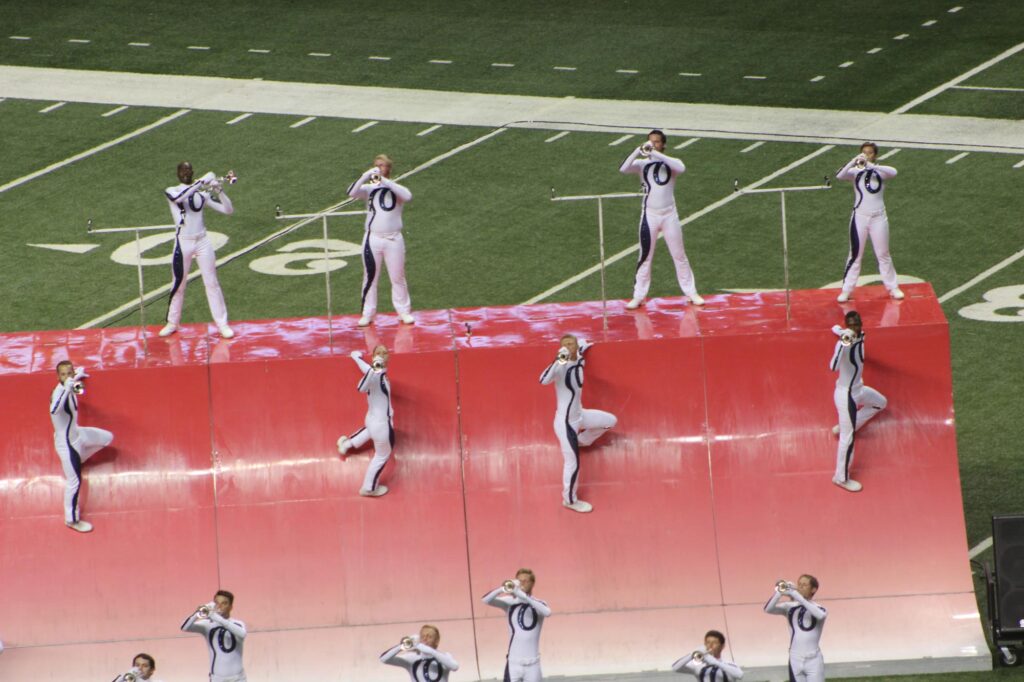 A drum corps performing on the field